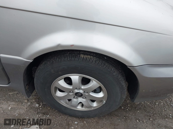2004 Kia Sedona LX with VIN KNDUP131546535352, listed as a IAAI auction lot 41856784 with 128,943 mi miles. Bid and sale history available at carsss.com. Image 6.