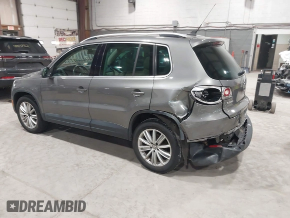 2011 Volkswagen Tiguan SE with VIN WVGBV7AX9BW524807, listed as a IAAI auction lot 41921439 with 204,813 mi miles and . Bid and sale history available at DreamBid. Image 3.