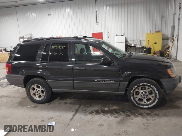 1999 Jeep Grand Cherokee Laredo with VIN 1J4GW58SXXC649579, listed as a IAAI auction lot 42365959 with 199,742 mi miles and . Bid and sale history available at DreamBid. Image 13.