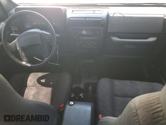 2003 Jeep Wrangler Sport z VIN 1J4FA49S43P327283, wystawiony jako Copart lot #59036295 z przebiegiem 158 108 mil mil oraz Szkoda całkowita • Salvage title. Historia ofert i sprzedaży dostępna na DreamBid. Obrazek 8.
