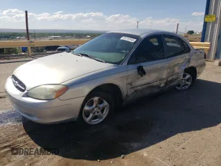 2003 Ford Taurus SES Standard with VIN 1FAFP55203G217515, listed as a Copart auction lot 59732345 with 145,021 mi miles and Salvage title. Bid and sale history available at DreamBid. Image 1.