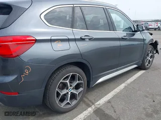 2019 BMW X1 xDrive28i with VIN WBXHT3C51K5L90571, listed as a IAAI auction lot 41909209 with 35,902 mi miles. Bid and sale history available at carsss.com. Image 18.