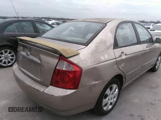 2004 Kia Spectra LX with VIN KNAFE121545043455, listed as a IAAI auction lot 41441356 with 189,566 mi miles. Bid and sale history available at carsss.com. Image 4.