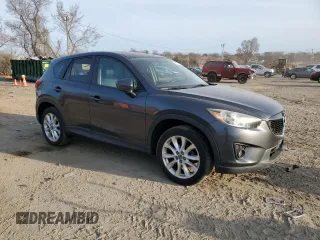 2014 Mazda CX-5 Grand Touring with VIN JM3KE4DY5E0372787, listed as a Copart auction lot 48873675 with 136,784 mi miles and Salvage Title. Bid and sale history available at carsss.com. Image 4.