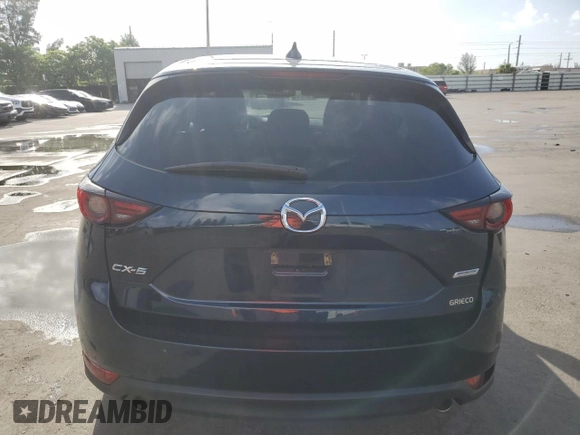 2018 Mazda CX-5 Grand Touring with VIN JM3KFADMXJ1353942, listed as a Copart auction lot 60570835 with 74,400 mi miles and Clean title. Bid and sale history available at DreamBid. Image 6.