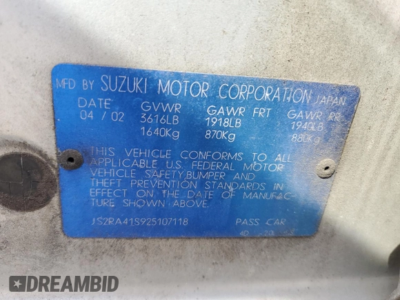 2002 Suzuki Aerio S z VIN JS2RA41S925107118, wystawiony jako Copart lot #50070535 z przebiegiem 128 111 mil mil oraz Szkoda całkowita • Salvage title. Historia ofert i sprzedaży dostępna na DreamBid. Obrazek 13.