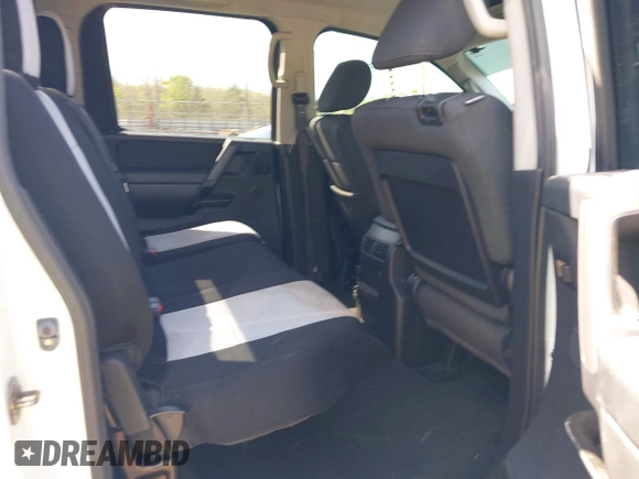 2014 Nissan Titan S with VIN 1N6AA0EC3EN502951, listed as a IAAI auction lot 41956309 with 128,464 mi miles and . Bid and sale history available at DreamBid. Image 8.