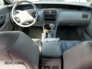 2000 Toyota Avalon XL with VIN 4T1BF28B3YU002835, listed as a Copart auction lot 50902115 with 128,699 mi miles and Salvage Title. Bid and sale history available at DreamBid. Image 8.