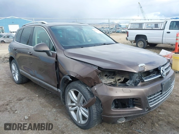 2013 Volkswagen Touareg Lux with VIN WVGEF9BP1DD012851, listed as a IAAI auction lot 41732391 with 123,283 mi miles and . Bid and sale history available at DreamBid. Image 1.