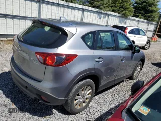 2015 Mazda CX-5 Sport z VIN JM3KE2BE3F0474927, wystawiony jako Copart lot #55444685 z przebiegiem 168 264 mil mil oraz Czysty tytuł • Clean title. Historia ofert i sprzedaży dostępna na DreamBid. Obrazek 3.
