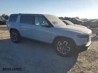 2023 Rivian R1S Adventure with VIN 7PDSGABA0PN005768, listed as a Copart auction lot 73223724 with 212 mi miles and Salvage Title. Bid and sale history available at carsss.com. Image 4.