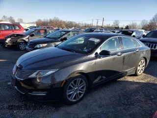 2015 Lincoln MKZ z VIN 3LN6L2J94FR613415, wystawiony jako Copart lot #43900165 z przebiegiem 214 087 mil mil oraz Szkoda całkowita • Salvage title. Historia ofert i sprzedaży dostępna na DreamBid. Obrazek 1.