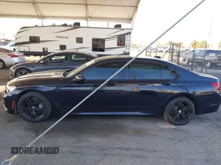 2019 BMW 7 Series 740i with VIN WBA7E2C58KB218419, listed as a IAAI auction lot 41831080 with 97,752 mi miles and . Bid and sale history available at DreamBid. Image 14.