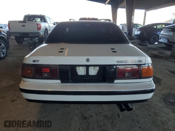 1986 Toyota Celica z VIN JT2ST64CXG7013064, wystawiony jako Copart lot #44228575 z przebiegiem 101 881 mil mil oraz Szkoda całkowita • Salvage title. Historia ofert i sprzedaży dostępna na DreamBid. Obrazek 6.