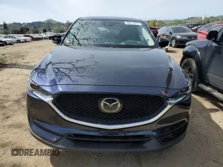 2021 Mazda CX-5 Grand Touring with VIN JM3KFBDM2M0494679, listed as a Copart auction lot 50017675 with 25,965 mi miles and Salvage Title. Bid and sale history available at carsss.com. Image 5.
