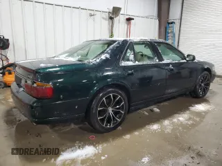 2000 Cadillac Seville Touring STS z VIN 1G6KY5494YU220613, wystawiony jako Copart lot #87338724 z przebiegiem 106 313 mil mil oraz Szkoda całkowita • Salvage title. Historia ofert i sprzedaży dostępna na DreamBid. Obrazek 3.
