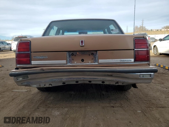 1989 Oldsmobile Delta z VIN 1G3HN54C2KW373577, wystawiony jako Copart lot #41532245 z przebiegiem 78 364 mil mil oraz Tytuł czysty. Historia ofert i sprzedaży dostępna na DreamBid. Obrazek 6.