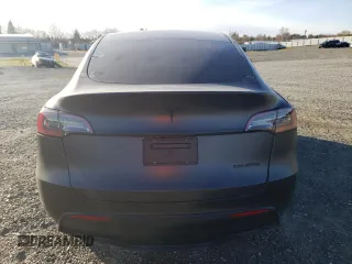 2024 Tesla Model Y Long Range with VIN 7SAYGDEE8RF002655, listed as a Copart auction lot 46422325 with 7,943 mi miles and Salvage Title. Bid and sale history available at DreamBid. Image 6.