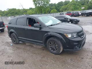 2019 Dodge Journey SE z VIN 3C4PDCBB4KT872951, wystawiony jako IAAI lot #42351041 z przebiegiem 50 563 mil mil oraz . Historia ofert i sprzedaży dostępna na DreamBid. Obrazek 1.