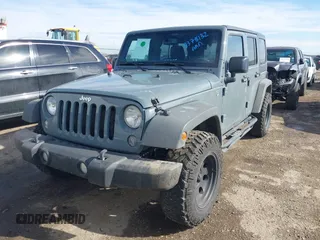 2014 Jeep Wrangler Unlimited Sport with VIN 1C4BJWDG9EL309763, listed as a IAAI auction lot 41378132 with 117,029 mi miles. Bid and sale history available at carsss.com. Image 20.