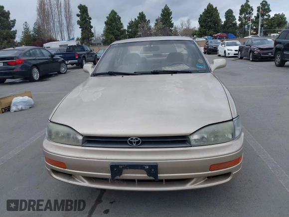 1994 Toyota Camry LE with VIN JT2SK12E0R0269820, listed as a IAAI auction lot 41908360 with 184,739 mi miles. Bid and sale history available at carsss.com. Image 6.