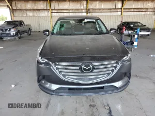 2021 Mazda CX-9 Touring z VIN JM3TCACYXM0520912, wystawiony jako Copart lot #60726695 z przebiegiem 36 506 mil mil oraz Szkoda całkowita • Salvage title. Historia ofert i sprzedaży dostępna na DreamBid. Obrazek 5.