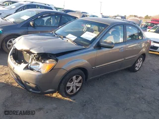 2011 Kia Rio LX with VIN KNADH4A38B6940831, listed as a IAAI auction lot 41287266 with 185,924 mi miles. Bid and sale history available at carsss.com. Image 2.