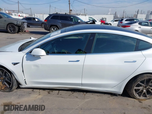 2019 Tesla Model 3 Long Range with VIN 5YJ3E1EB1KF510912, listed as a IAAI auction lot 41857775 with Not Provided miles and . Bid and sale history available at DreamBid. Image 14.