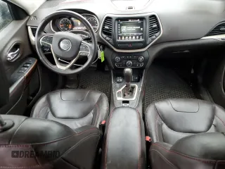 2015 Jeep Cherokee Trailhawk with VIN 1C4PJMBS9FW605075, listed as a Copart auction lot 49256195 with 103,677 mi miles and Salvage Title. Bid and sale history available at DreamBid. Image 8.