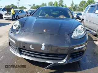 2014 Porsche Panamera S E-Hybrid with VIN WP0AD2A76EL044591, listed as a IAAI auction lot 42436817 with 89,009 mi miles and . Bid and sale history available at DreamBid. Image 6.