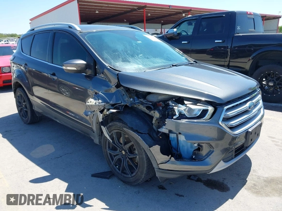 2017 Ford Escape Titanium with VIN 1FMCU0J97HUE07747, listed as a IAAI auction lot 41977788 with 104,560 mi miles. Bid and sale history available at carsss.com. Image 1.