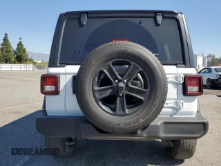 2023 Jeep Wrangler Sport Altitude with VIN 1C4HJXDG3PW623930, listed as a Copart auction lot 46733035 with 26,032 mi miles and Salvage Title. Bid and sale history available at DreamBid. Image 6.