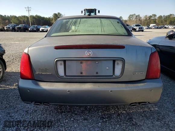 2003 Cadillac DeVille DTS z VIN 1G6KF579X3U233215, wystawiony jako Copart lot #48636775 z przebiegiem 99 144 mil mil oraz Nie do naprawy. Historia ofert i sprzedaży dostępna na DreamBid. Obrazek 6.