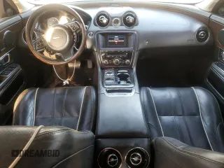 2014 Jaguar XJ Portfolio with VIN SAJWJ2GD7E8V61558, listed as a Copart auction lot 66850034 with 130,984 mi miles and Salvage title. Bid and sale history available at DreamBid. Image 8.