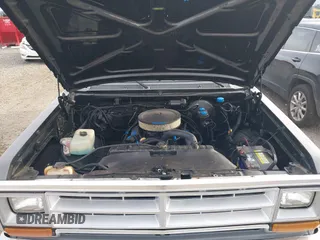 1988 Dodge D/W 100 with VIN 1B7FD04X9JS676023, listed as a IAAI auction lot 40746708 with 98,215 mi miles. Bid and sale history available at carsss.com. Image 10.