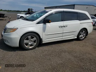 2012 Honda Odyssey Touring с VIN 5FNRL5H91CB091137, выставлен на аукционе Copart как лот 60513465 с пробегом 144 489 миль миль и Чистый • Clean title. История ставок и продаж доступна на DreamBid. Изображение 1.