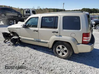 2010 Jeep Liberty Sport with VIN 1J4PP2GK9AW128825, listed as a Copart auction lot 48113835 with 258,730 mi miles and Salvage Title. Bid and sale history available at DreamBid. Image 2.