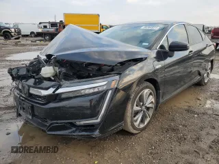 2018 Honda Clarity Touring z VIN JHMZC5F31JC023234, wystawiony jako Copart lot #86364934 z przebiegiem Nie podano mil oraz Szkoda całkowita • Salvage title. Historia ofert i sprzedaży dostępna na DreamBid. Obrazek 1.