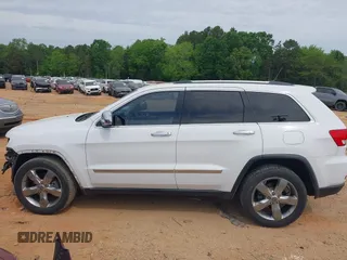 2013 Jeep Grand Cherokee Overland with VIN 1C4RJECGXDC621227, listed as a IAAI auction lot 42098042 with 194,232 mi miles and . Bid and sale history available at DreamBid. Image 14.
