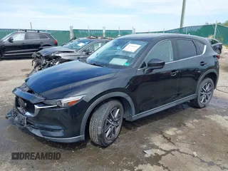 2018 Mazda CX-5 Grand Touring z VIN JM3KFBDM5J0307785, wystawiony jako IAAI lot #42302609 z przebiegiem 81 974 mil mil oraz . Historia ofert i sprzedaży dostępna na DreamBid. Obrazek 18.