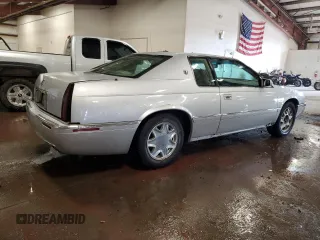 1999 Cadillac Eldorado z VIN 1G6EL12Y1XU611974, wystawiony jako Copart lot #71761494 z przebiegiem 139 494 mil mil oraz Czysty tytuł • Clean title. Historia ofert i sprzedaży dostępna na DreamBid. Obrazek 3.