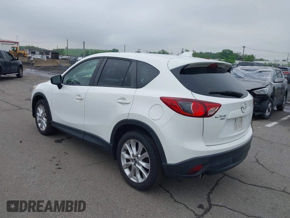 2015 Mazda CX-5 Grand Touring with VIN JM3KE4DY5F0530854, listed as a IAAI auction lot 42274582 with 144,732 mi miles and . Bid and sale history available at DreamBid. Image 3.