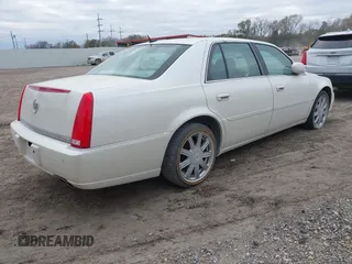 2008 Cadillac DTS w/1SD with VIN 1G6KD57Y28U200858, listed as a IAAI auction lot 41330235 with 103,446 mi miles. Bid and sale history available at carsss.com. Image 4.