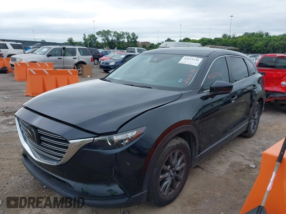 2021 Mazda CX-9 Sport with VIN JM3TCABY6M0522352, listed as a IAAI auction lot 42613136 with 106,167 mi miles and . Bid and sale history available at DreamBid. Image 14.