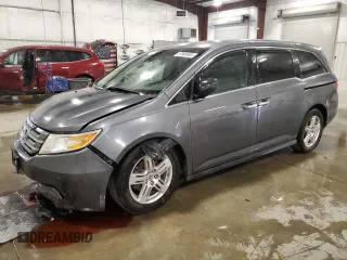 2012 Honda Odyssey Touring z VIN 5FNRL5H98CB028309, wystawiony jako Copart lot #57663485 z przebiegiem 233 921 mil mil oraz Szkoda całkowita • Salvage title. Historia ofert i sprzedaży dostępna na DreamBid. Obrazek 1.