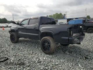 2020 Toyota Tacoma SR5 with VIN 3TMCZ5AN0LM299243, listed as a Copart auction lot 58818825 with 76,449 mi miles and Salvage title. Bid and sale history available at DreamBid. Image 2.