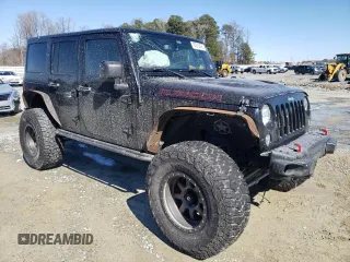 2016 Jeep Wrangler Unlimited Rubicon Hard Rock with VIN 1C4BJWFG9GL209484, listed as a Copart auction lot 87815475 with 85,729 mi miles and Salvage Title. Bid and sale history available at carsss.com. Image 4.