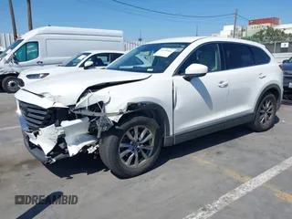 2019 Mazda CX-9 Touring with VIN JM3TCACY5K0306424, listed as a IAAI auction lot 42150466 with 95,166 mi miles and . Bid and sale history available at DreamBid. Image 2.