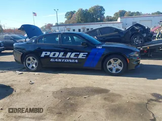 2022 Dodge Charger Police with VIN 2C3CDXAT3NH109952, listed as a IAAI auction lot 40919989 with 19,169 mi miles and . Bid and sale history available at DreamBid. Image 13.