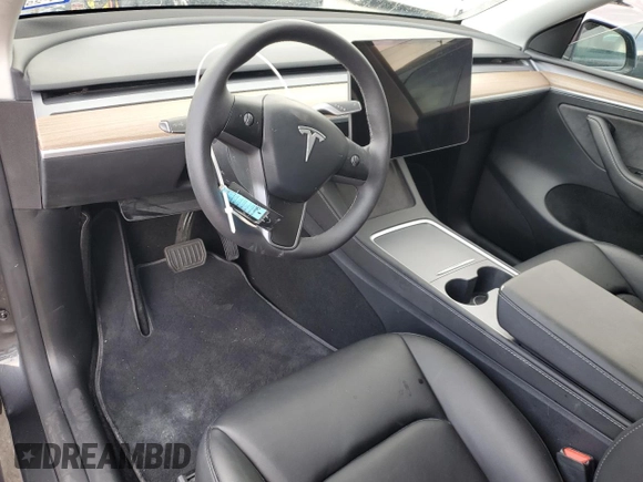2024 Tesla Model Y with VIN 7SAYGDED1RF052031, listed as a Copart auction lot 48507865 with 5,365 mi miles and Salvage title. Bid and sale history available at DreamBid. Image 8.